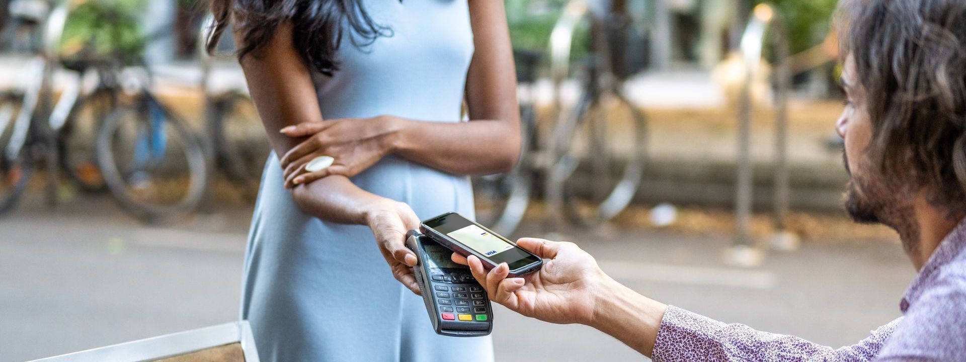 woman taking contactless payment