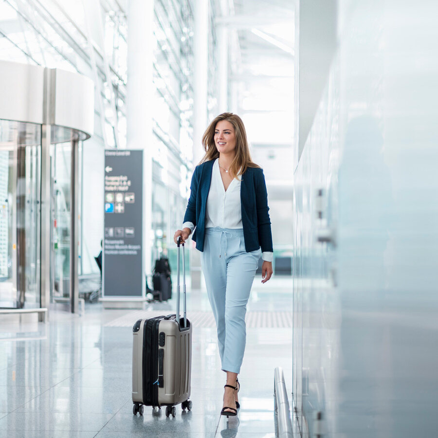 Woman walking with suitcase