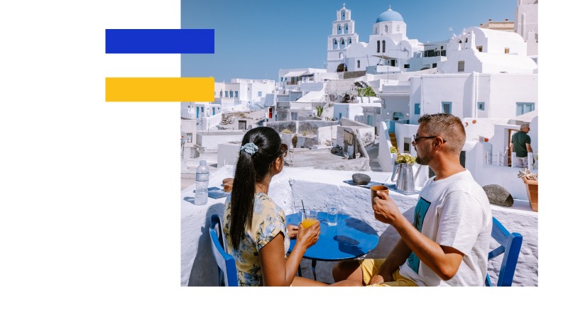 couple on rooftop bar in greece