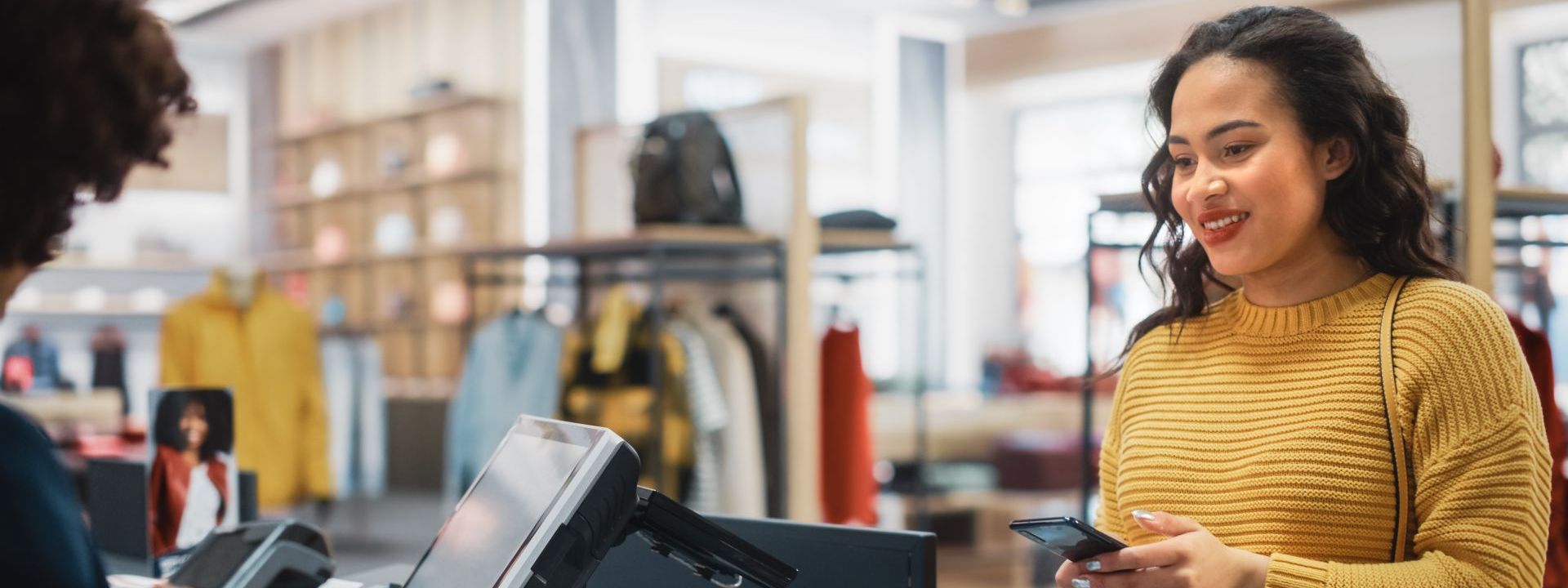 woman paying at till